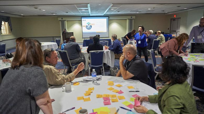 Group of people sitting around a table during workshop